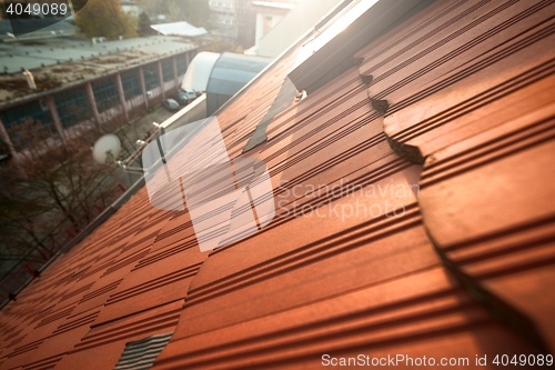 Image of Roof tile over blue sky