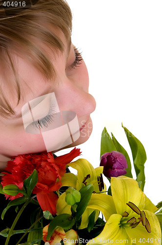 Image of Young dreamy teenager girl with flowers