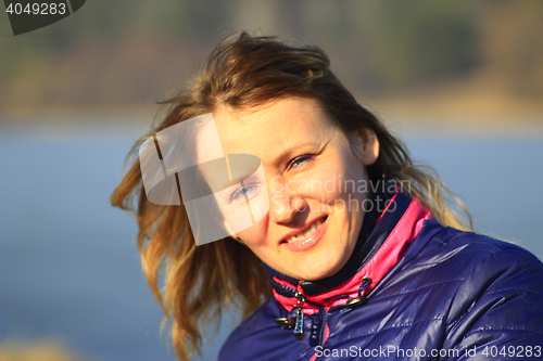 Image of portrait of blue-eyed smiling woman