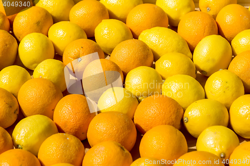 Image of fresh oranges in a wooden box