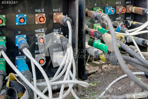 Image of electrical power cables connected to a temporary outdoors distribution station