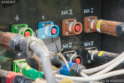 Image of electrical power cables connected to a temporary outdoors distribution station