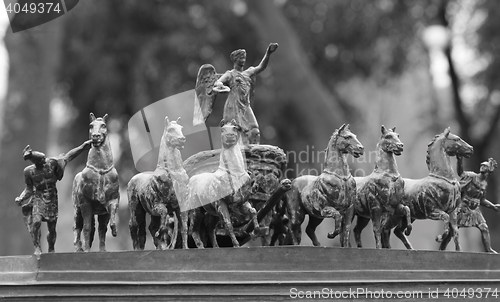 Image of horses in a chariot sculpture