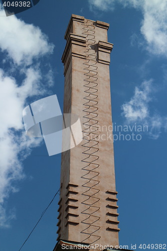 Image of  industrial chimney with a ladder