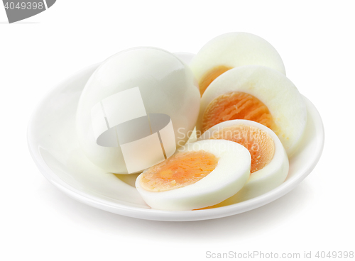 Image of sliced egg on white plate