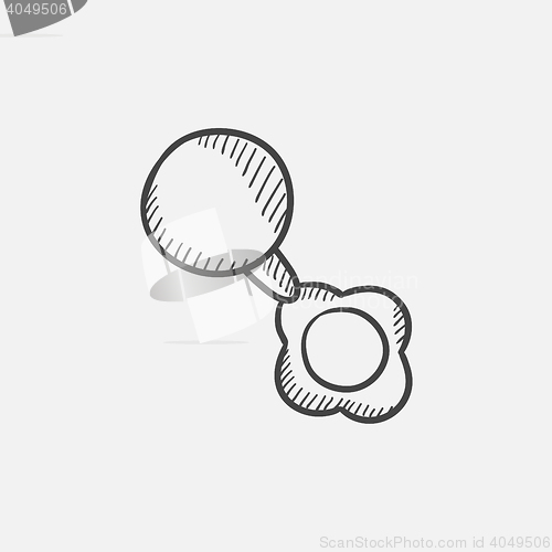 Image of Baby rattle sketch icon.