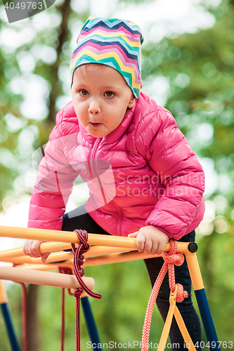 Image of The little baby girl playing at outdoor playground