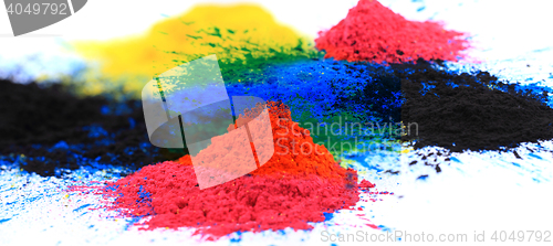 Image of cmyk toner powder (cyan, magenta, yellow, black)