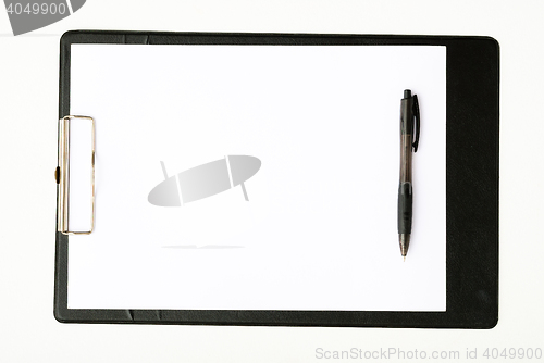 Image of Black clipboard with a pen isolated