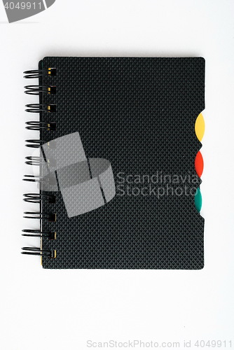 Image of notepad with pen isolated