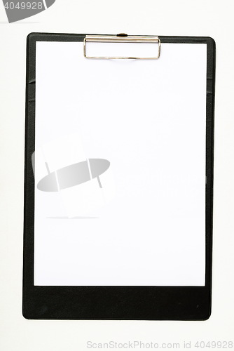 Image of Black clipboard with a pen isolated