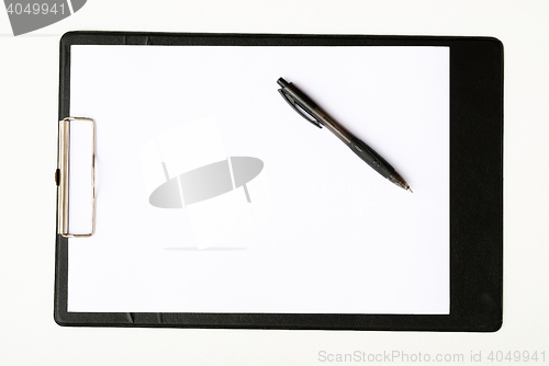 Image of Black clipboard with a pen isolated