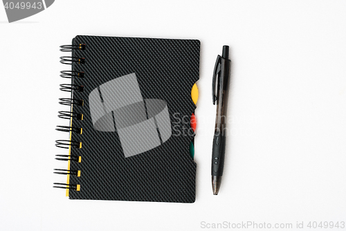 Image of notepad with pen isolated