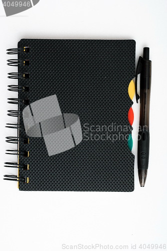 Image of notepad with pen isolated