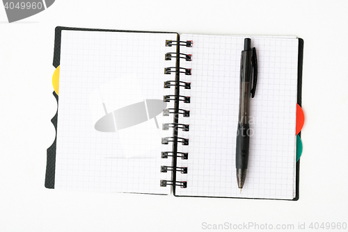 Image of notepad with pen isolated