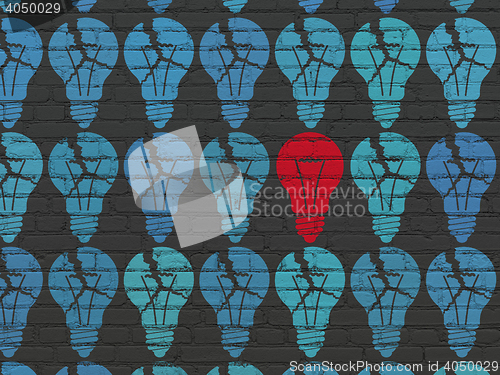 Image of Finance concept: light bulb icon on wall background