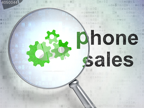 Image of Marketing concept: Gears and Phone Sales with optical glass