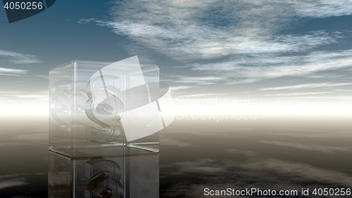 Image of paragraph symbol in glass cube under cloudy sky - 3d rendering