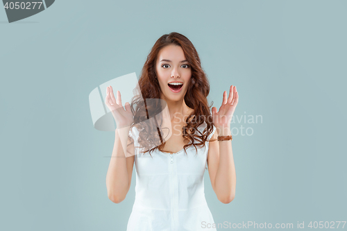 Image of Portrait of young woman with shocked facial expression