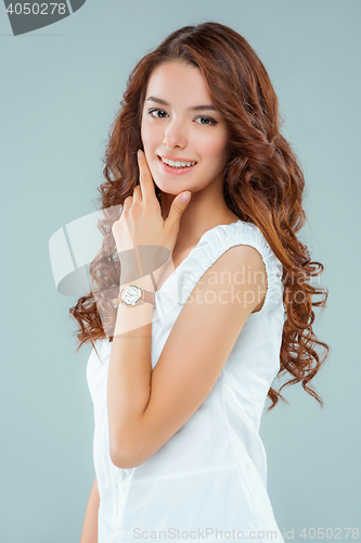 Image of The happy woman on gray background