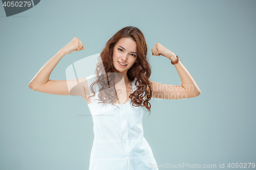 Image of The happy woman on gray background