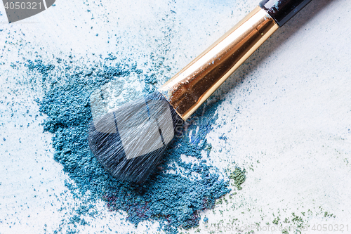 Image of blue shadows with brush piled on white background