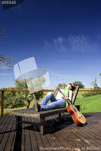 Image of Woman with a guitar