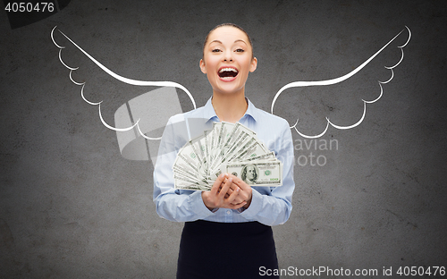 Image of businesswoman with dollar money and angel wings