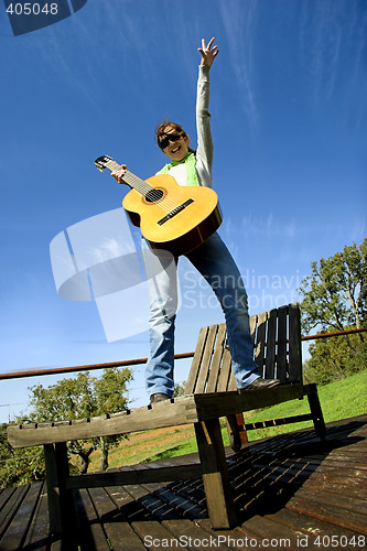 Image of Woman with a guitar