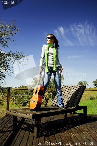 Image of Woman with a guitar