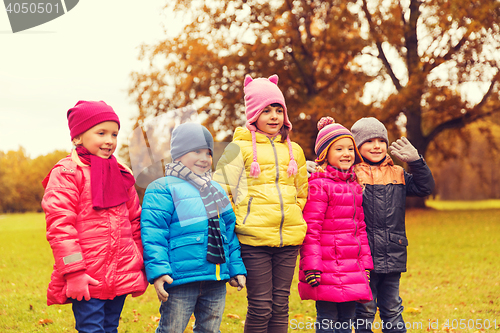 Image of group of happy children in autumn park