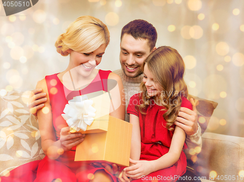 Image of happy family opening gift box