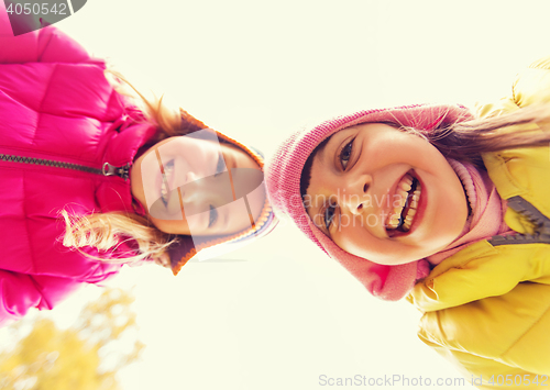 Image of happy girls faces outdoors