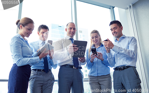 Image of business people with tablet pc and smartphones