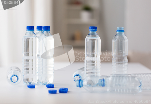 Image of close up of bottles with drinking water on table