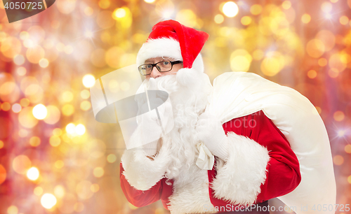 Image of man in costume of santa claus with bag