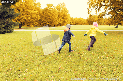 Image of group of happy little kids running outdoors