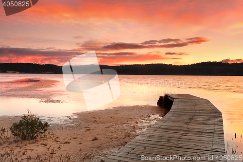 Image of Vibrant skies and curved jetty