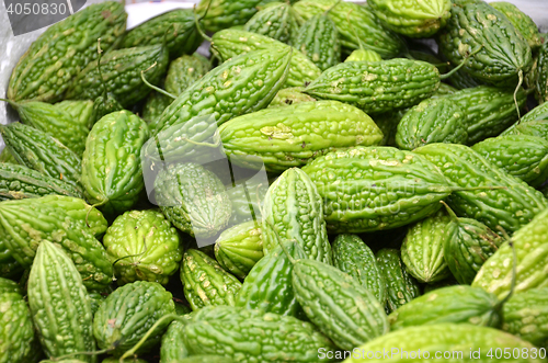 Image of Pile of bitter melons on market in Little India district