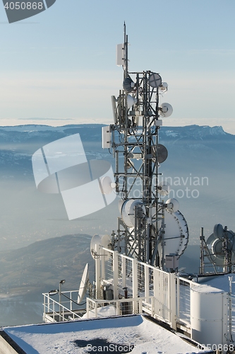 Image of Transmitter towers on a hill in winter