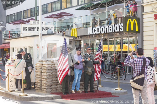 Image of People taking pictures and selfies at check point Charlie, Berlin, Germany.