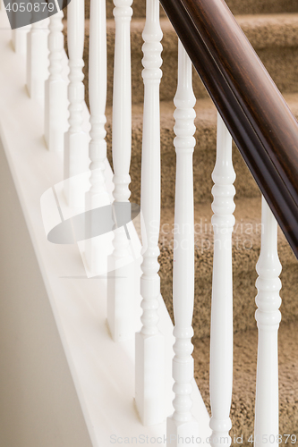 Image of Abstract of Stair Railing and Carpeted Steps in House