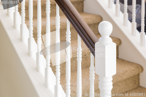 Image of Abstract of Stair Railing and Carpeted Steps in House