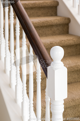 Image of Abstract of Stair Railing and Carpeted Steps in House