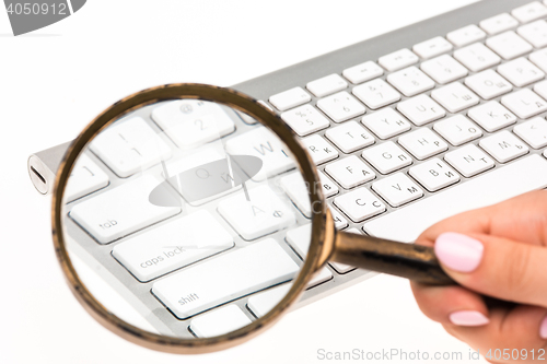 Image of Laptop with a magnifying glass