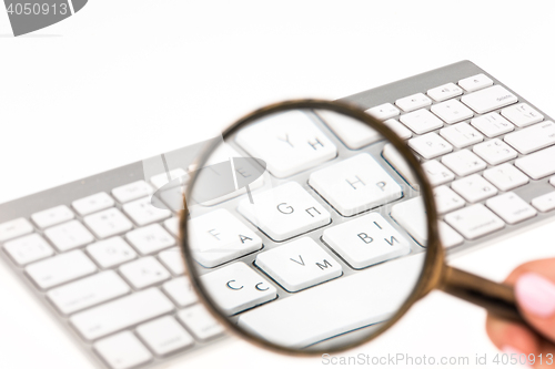 Image of Laptop with a magnifying glass
