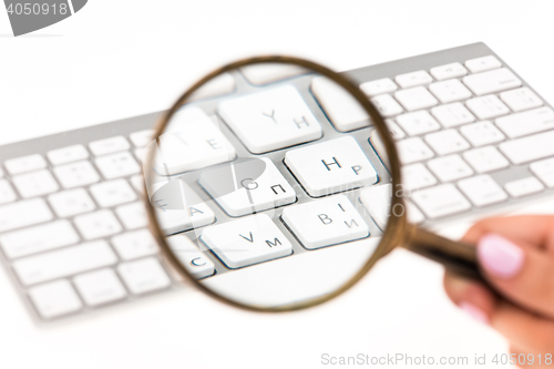 Image of Laptop with a magnifying glass