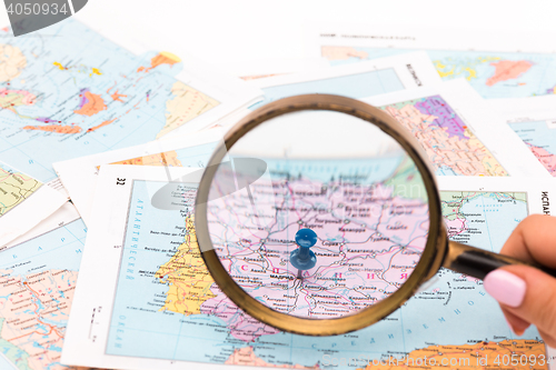 Image of magnifying glass on a map - close-up