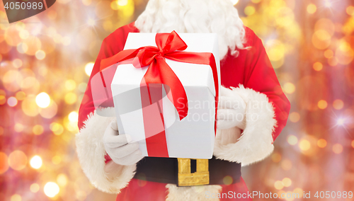 Image of man in costume of santa claus with gift box