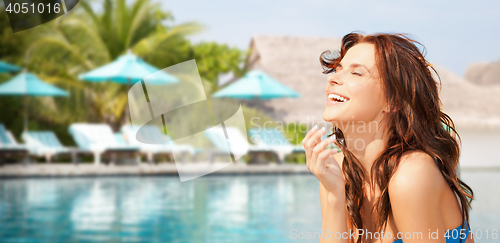 Image of happy beautiful woman on tropical beach